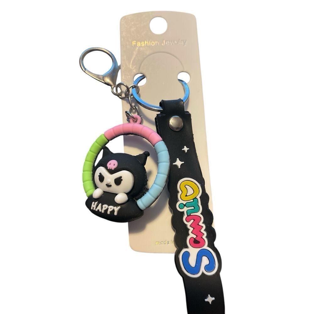 SANRIO KEYCHAIN BLACK WITH HAPPY ON IT
